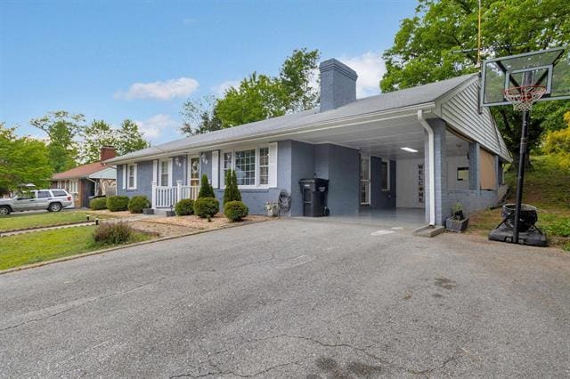 3325 Fleetwood Ave SW, Roanoke, VA 24015 - ranch-style home with a chimney, asphalt driveway, and an attached carport