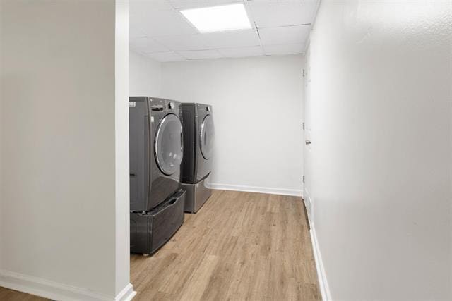 3325 Fleetwood Ave SW, Roanoke, VA 24015 - washroom featuring washer and clothes dryer and light wood finished floors