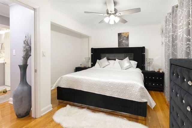 3325 Fleetwood Ave SW, Roanoke, VA 24015 - bedroom featuring wood finished floors, ornamental molding, and a ceiling fan