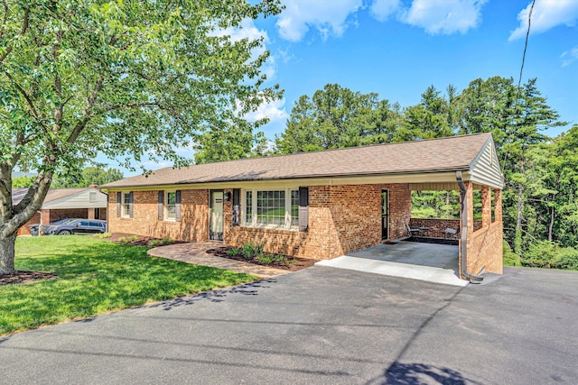 716 Arcadia Cir, Vinton, VA 24179 - ranch-style house featuring asphalt driveway, brick siding, a front lawn, and a carport