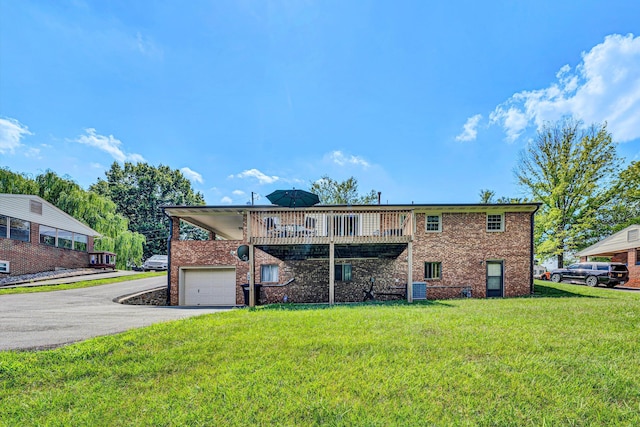 716 Arcadia Cir, Vinton, VA 24179 - rear view of house with driveway, a yard, brick siding, and a garage