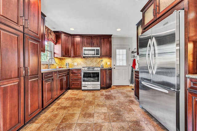 716 Arcadia Cir, Vinton, VA 24179 - kitchen featuring appliances with stainless steel finishes, backsplash, recessed lighting, dark brown cabinets, and light countertops