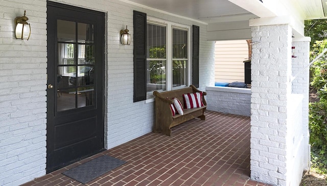 2506 Rosalind Ave SW, Roanoke, VA 24014 - view of exterior entry with covered porch and brick siding