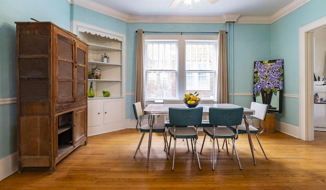 2506 Rosalind Ave SW, Roanoke, VA 24014 - dining space featuring crown molding, light wood-type flooring, and a ceiling fan