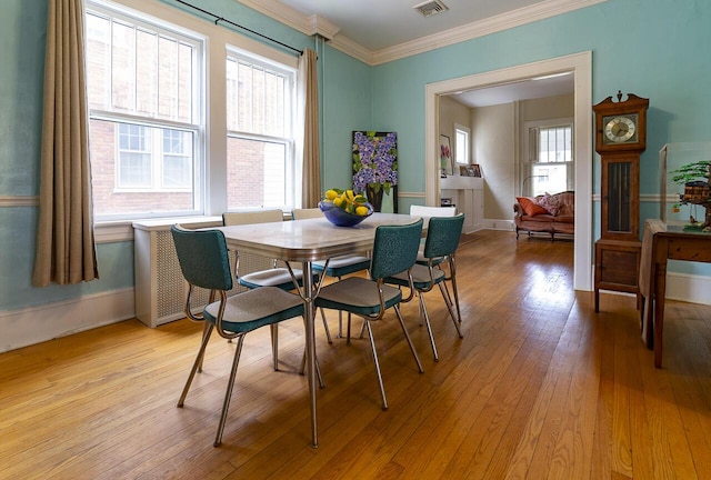 2506 Rosalind Ave SW, Roanoke, VA 24014 - dining room with light wood-style floors and crown molding