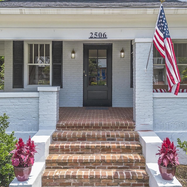 2506 Rosalind Ave SW, Roanoke, VA 24014 - property entrance featuring a porch and brick siding