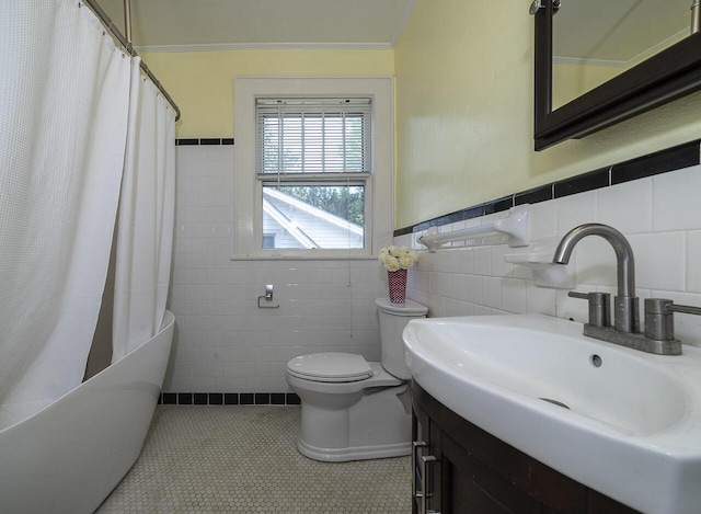 2506 Rosalind Ave SW, Roanoke, VA 24014 - full bath with tile walls, tile patterned flooring, shower / bathtub combination with curtain, crown molding, and vanity