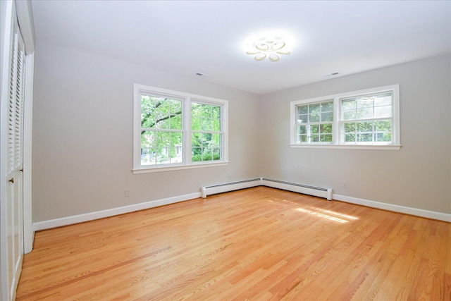 115 Bartley Dr, Salem, VA 24153 - unfurnished bedroom with wood finished floors and a baseboard heating unit