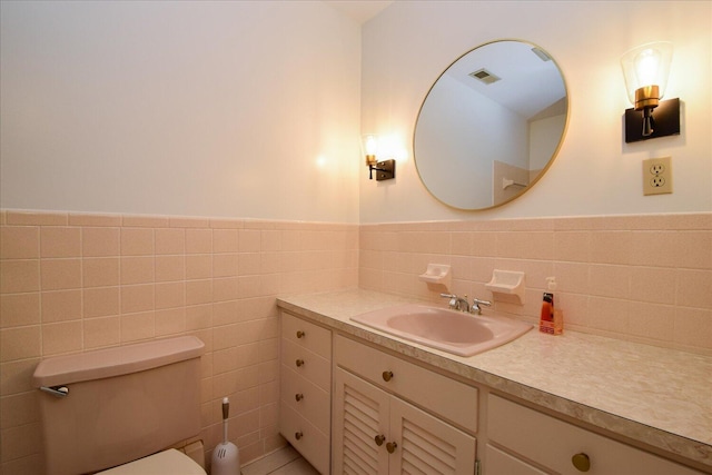 115 Bartley Dr, Salem, VA 24153 - bathroom with vanity, tile walls, and wainscoting