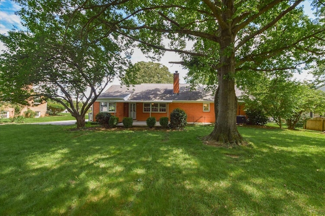 115 Bartley Dr, Salem, VA 24153 - view of front facade with a chimney, a front lawn, and brick siding