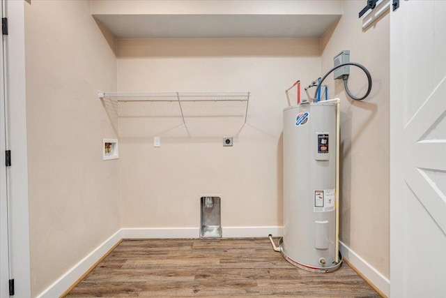 3141 Trinity Rd, Troutville, VA 24175 - laundry room featuring electric water heater, washer hookup, wood finished floors, electric dryer hookup, and a barn door