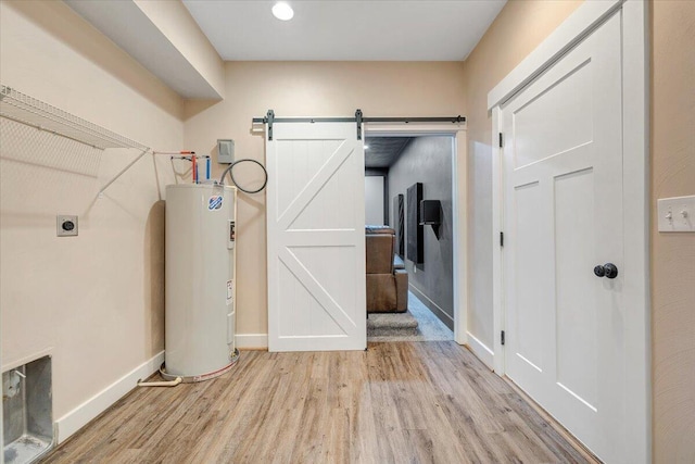 3141 Trinity Rd, Troutville, VA 24175 - laundry area featuring electric water heater, electric dryer hookup, wood finished floors, and a barn door