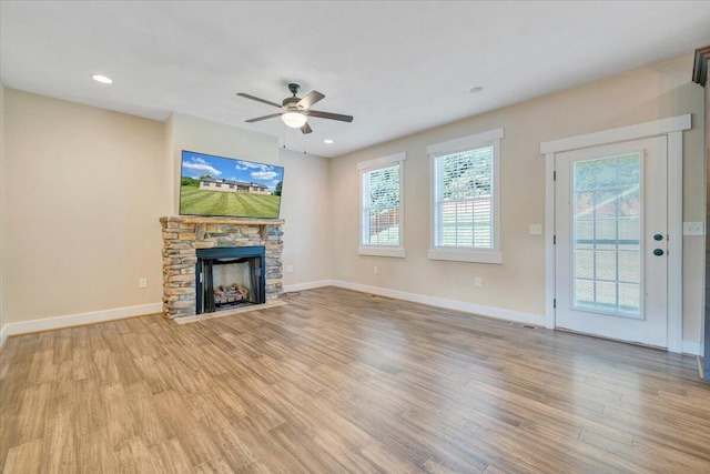 3141 Trinity Rd, Troutville, VA 24175 - unfurnished living room with light wood-style floors, a ceiling fan, a fireplace, and recessed lighting