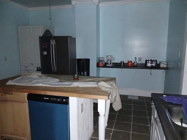 918 Dale Ave SE, Roanoke, VA 24013 - kitchen with freestanding refrigerator, dishwasher, ornamental molding, dark tile patterned floors, and dark countertops