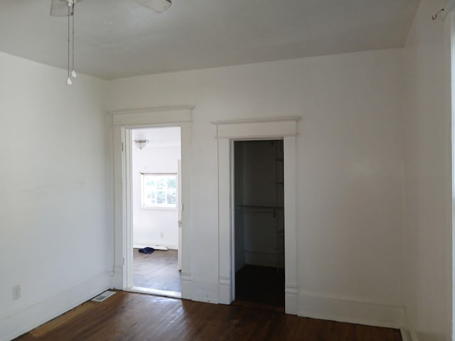 918 Dale Ave SE, Roanoke, VA 24013 - unfurnished bedroom featuring dark wood-style flooring and a spacious closet