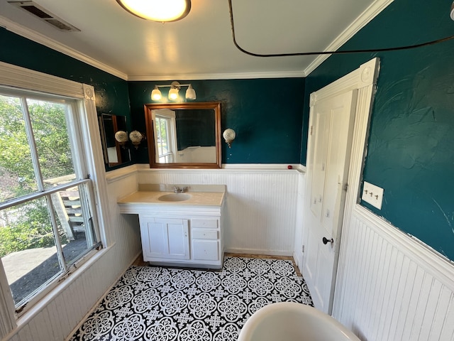 405 Mountain Ave SW, Roanoke, VA 24016 - bathroom featuring a wainscoted wall, vanity, tile patterned flooring, and ornamental molding