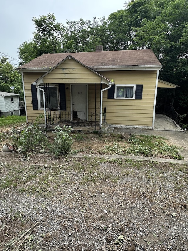 324 10th St, Vinton, VA 24179 - bungalow-style house featuring covered porch and a chimney