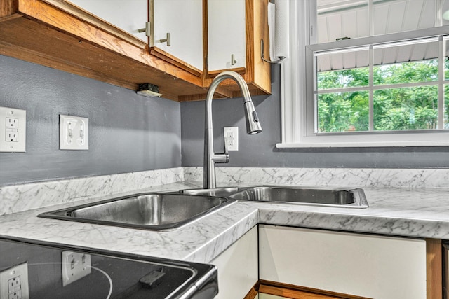 3717 Martinell Ave, Roanoke, VA 24018 - kitchen featuring dishwasher, light countertops, and white cabinets