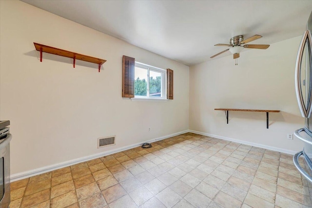 618 Gladies St NW, Roanoke, VA 24017 - spare room featuring a ceiling fan and baseboards