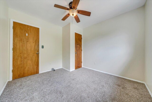 618 Gladies St NW, Roanoke, VA 24017 - carpeted spare room with baseboards and a ceiling fan