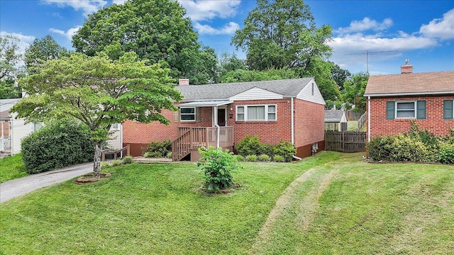 618 Gladies St NW, Roanoke, VA 24017 - view of front of home featuring brick siding and a chimney