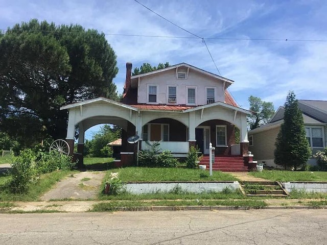 2229 Hanover Ave NW, Roanoke, VA 24017 - view of front of home featuring covered porch, stucco siding, and a metal roof