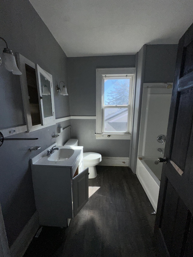 2229 Hanover Ave NW, Roanoke, VA 24017 - bathroom with vanity, wood finished floors, and bathing tub / shower combination