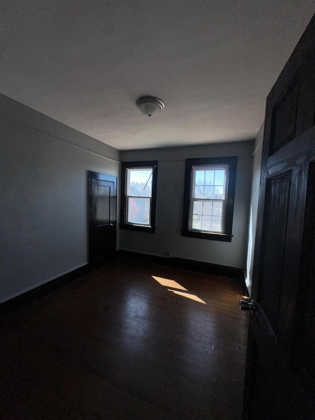 2229 Hanover Ave NW, Roanoke, VA 24017 - empty room with dark wood-type flooring and baseboards
