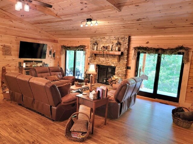 350 Sizer Ln, New Castle, VA 24127 - living room featuring wood ceiling, wood finished floors, wooden walls, a fireplace, and a ceiling fan