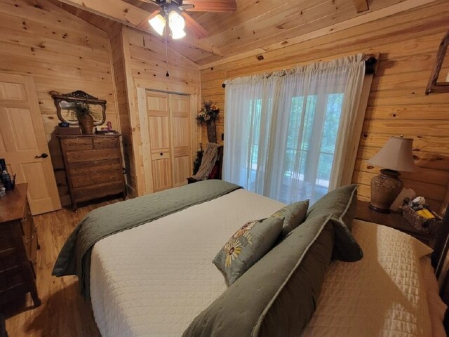 350 Sizer Ln, New Castle, VA 24127 - bedroom with wooden walls, wood finished floors, and ceiling fan