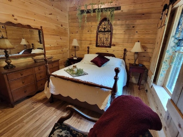 350 Sizer Ln, New Castle, VA 24127 - bedroom with light wood finished floors and wood walls