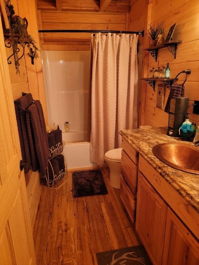 350 Sizer Ln, New Castle, VA 24127 - full bath with wooden walls, vanity, wood finished floors, and shower / bath combo