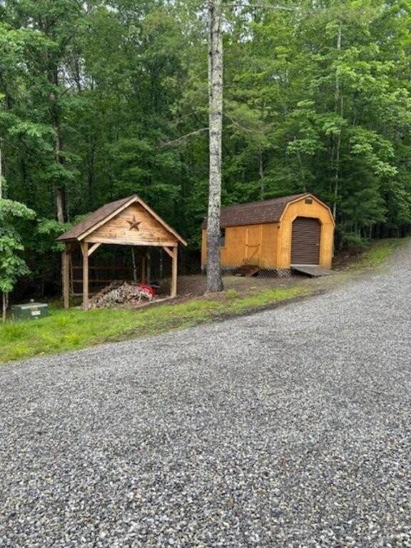 350 Sizer Ln, New Castle, VA 24127 - view of outdoor structure featuring a view of trees and a gazebo