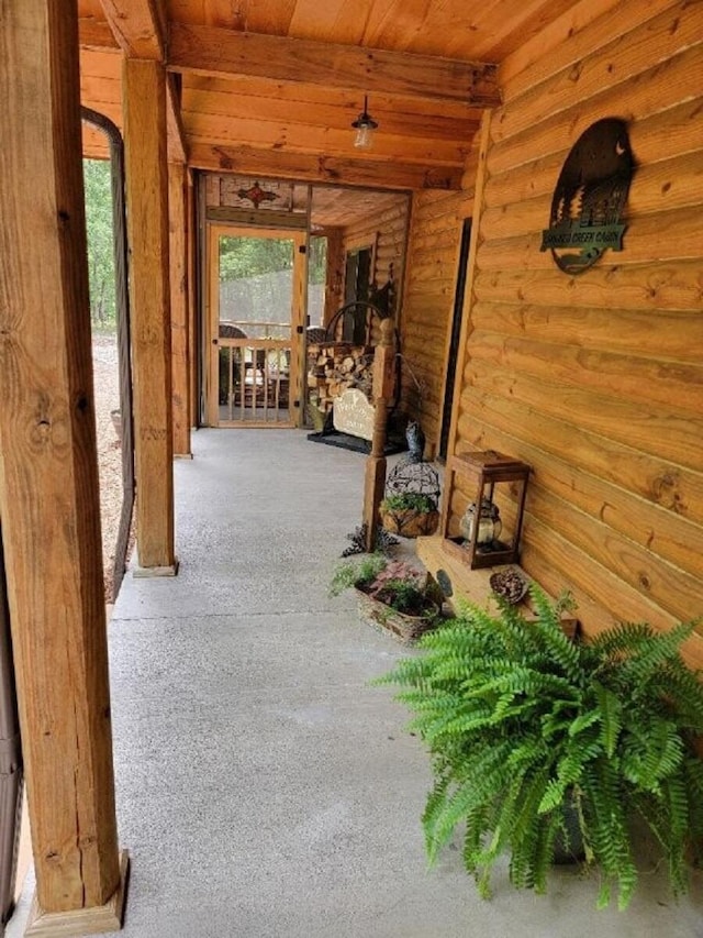 350 Sizer Ln, New Castle, VA 24127 - hallway featuring wood ceiling, rustic walls, and carpet floors
