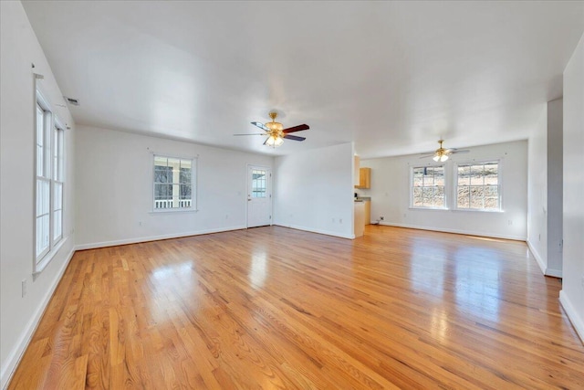 2534 Paris Mountain Rd, Elliston, VA 24087 - unfurnished living room featuring a ceiling fan and light wood-style floors