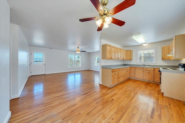 2534 Paris Mountain Rd, Elliston, VA 24087 - kitchen with light brown cabinetry, light wood finished floors, electric range, a ceiling fan, and open floor plan