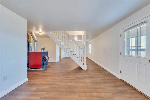 2534 Paris Mountain Rd, Elliston, VA 24087 - foyer entrance featuring stairs, wood finished floors, and a wood stove