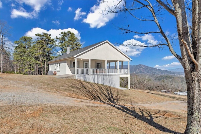2534 Paris Mountain Rd, Elliston, VA 24087 - view of front of property featuring covered porch, dirt driveway, and a mountain view