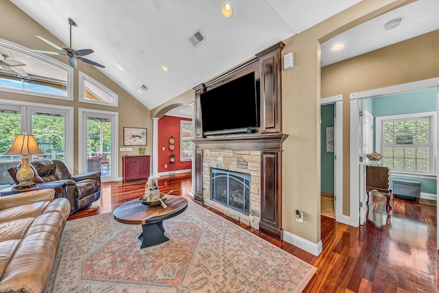 325 Bull Run Trl, Penhook, VA 24137 - living room featuring a ceiling fan, arched walkways, a stone fireplace, wood finished floors, and recessed lighting