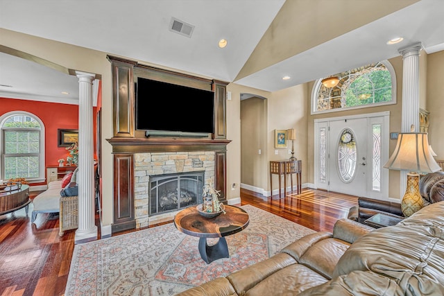 325 Bull Run Trl, Penhook, VA 24137 - living room featuring decorative columns, wood finished floors, a high ceiling, a stone fireplace, and recessed lighting