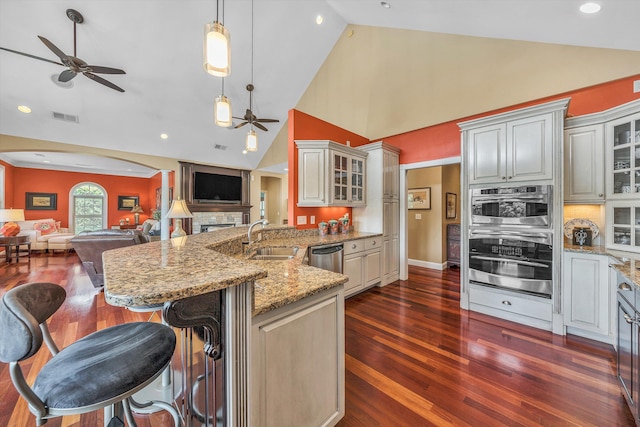 325 Bull Run Trl, Penhook, VA 24137 - kitchen featuring a ceiling fan, open floor plan, a peninsula, dark wood finished floors, and high vaulted ceiling