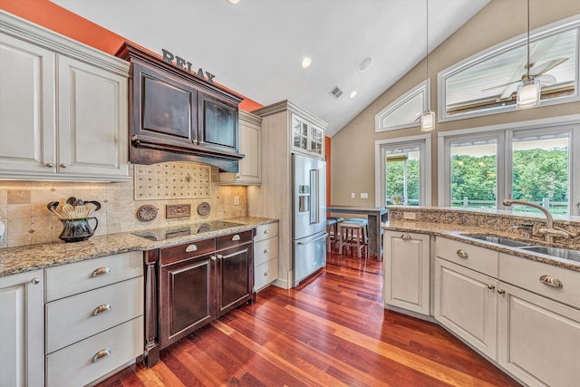 325 Bull Run Trl, Penhook, VA 24137 - kitchen with high quality fridge, black electric stovetop, dark wood finished floors, tasteful backsplash, and recessed lighting