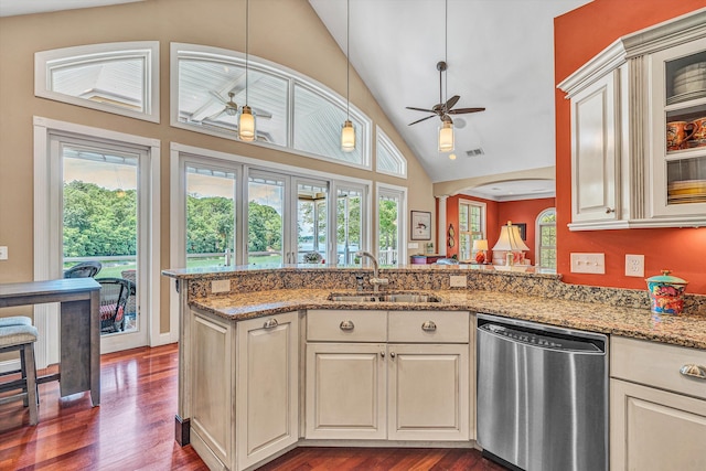 325 Bull Run Trl, Penhook, VA 24137 - kitchen with stainless steel dishwasher, cream cabinetry, dark wood-type flooring, and high vaulted ceiling