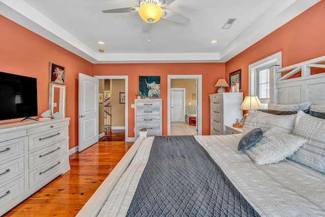 325 Bull Run Trl, Penhook, VA 24137 - bedroom with light wood finished floors, recessed lighting, connected bathroom, a raised ceiling, and ceiling fan