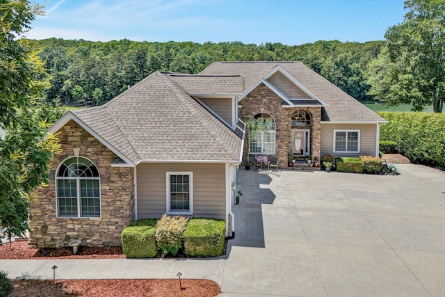 325 Bull Run Trl, Penhook, VA 24137 - view of front of property with stone siding, roof with shingles, and a forest view