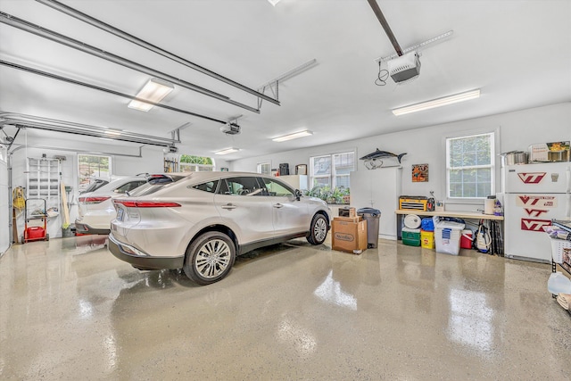 325 Bull Run Trl, Penhook, VA 24137 - garage featuring freestanding refrigerator and a garage door opener