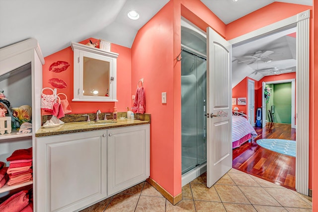 325 Bull Run Trl, Penhook, VA 24137 - ensuite bathroom with vaulted ceiling, a ceiling fan, vanity, a shower stall, and tile patterned floors