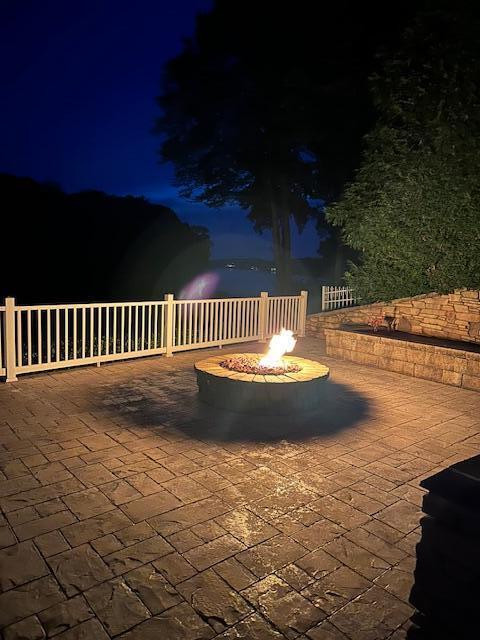 325 Bull Run Trl, Penhook, VA 24137 - patio at night with an outdoor fire pit and a patio