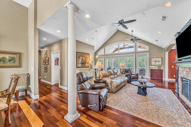 325 Bull Run Trl, Penhook, VA 24137 - living room featuring ornate columns, ceiling fan, a stone fireplace, high vaulted ceiling, and dark wood-style floors