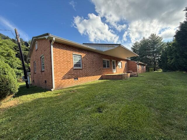2612 Webster Rd, Roanoke, VA 24012 - rear view of property with crawl space, brick siding, and a yard